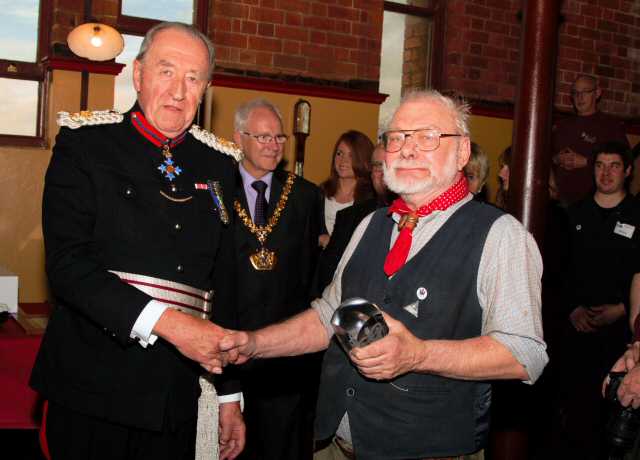 The commemorative crystal was presented by The Vice Lord-Lieutenant of Staffordshire, Colonel Michael Beatty, to one of the longest serving volunteers, Bill Britland